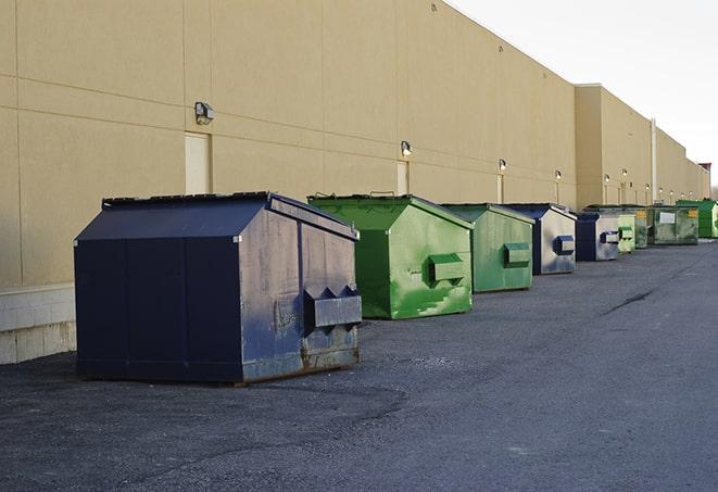 metal waste containers sit at a busy construction site in Grosse Pointe Farms, MI